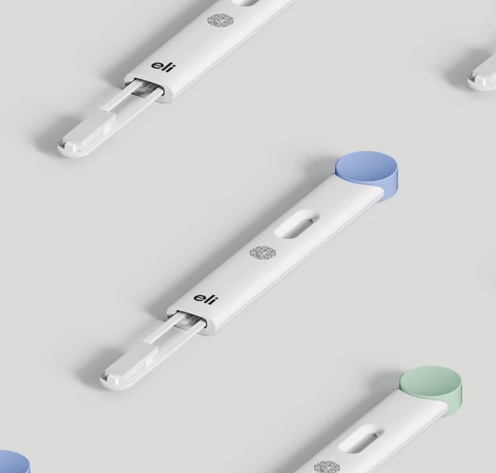 The Eli hormonal tracker is a sleek, pen-like device with a minimalist design in white and pastel colors like blue and green. It features a rounded cap and a small slot for easy use. Designed to track hormonal health, it's non-invasive and revolutionary in personalized health tech.