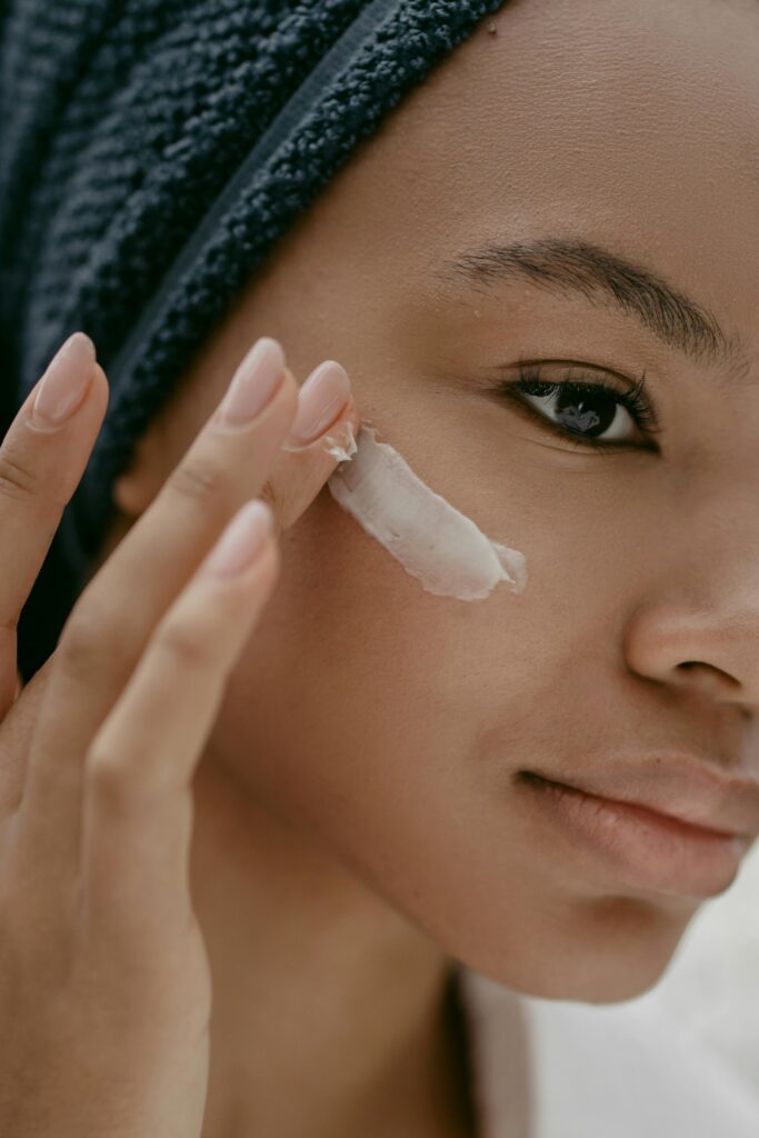 African-american model applying skincare