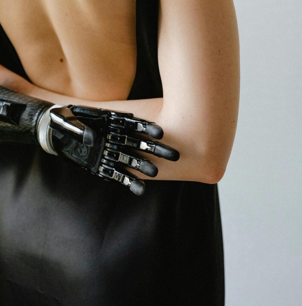 bionic arm behind back of woman