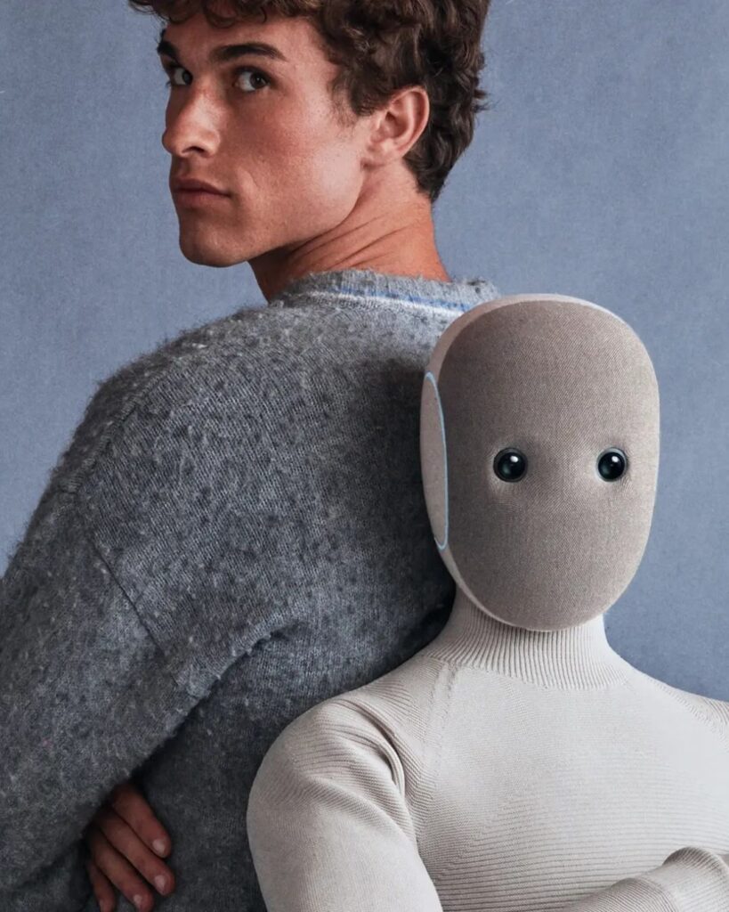 A human model stands back-to-back with the NEO robot, illustrating the relationship between humans and AI companions in everyday life.