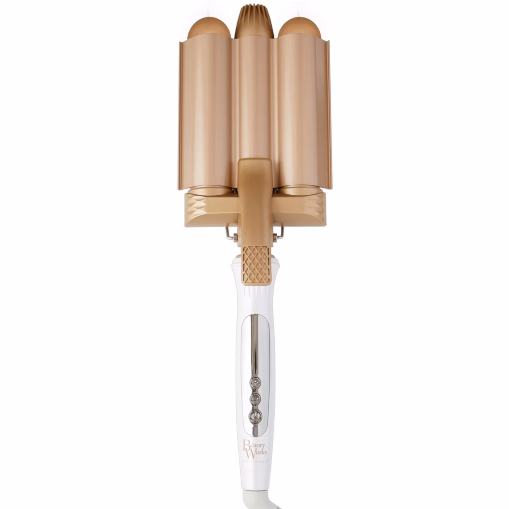 Image of the Beauty Works Gold Jumbo Waver hair tool featuring triple gold ceramic barrels and a white handle, designed to create large, glossy mermaid waves.