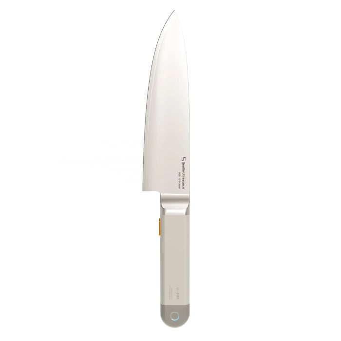 Seattle Ultrasonics C200 ultrasonic chef’s knife with minimalist handle and stainless steel blade, designed to reduce cutting effort using high-frequency vibration.