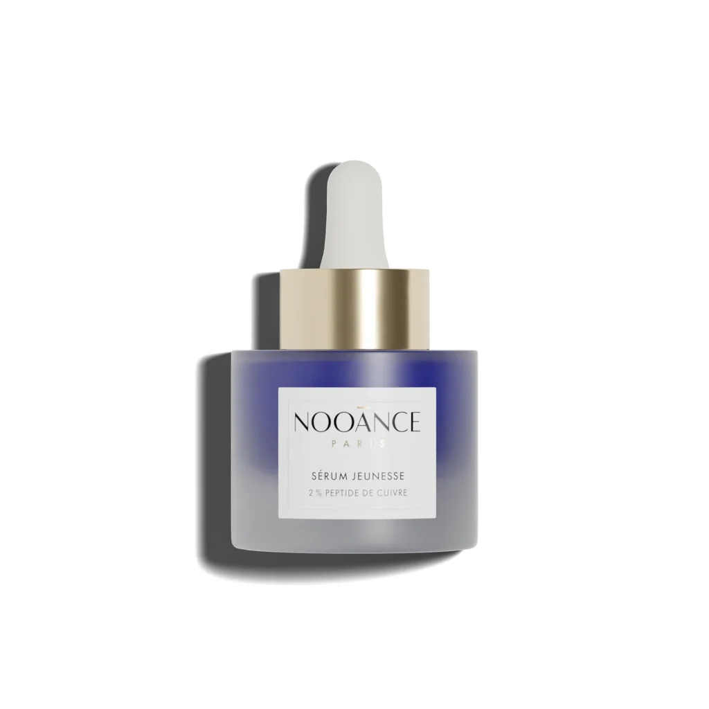 Nooānce Paris Copper Peptide Serum 2% shown in a luxury glass bottle, an anti-ageing treatment designed to firm skin, reduce wrinkles and support collagen production.