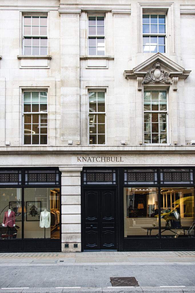 Exterior of Knatchbull store at 32 Savile Row London, showcasing womenswear tailoring storefront with classic British architecture and window displays.